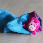 animal sock poms via lilblueboo.com Animal Sock Poms