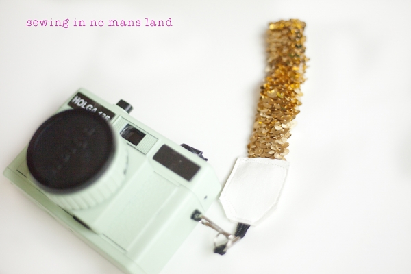 12 DIY Camera Strap Ideas: Frosted Wristlet Camera Strap by Sewing in No Mans Land via lilblueboo.com