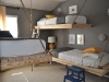 Shared Bedroom Ideas for Kids: Room for Three at The Bumper Crop via lilblueboo.com