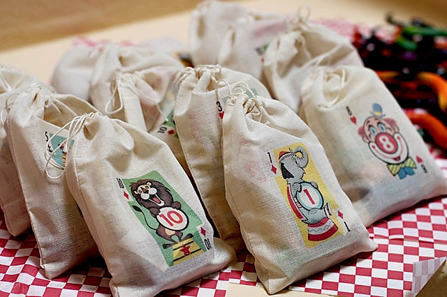 Circus playing card muslin party favor bag via lilblueboo.com