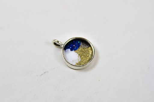 Make a Rainbow Glitter Resin Pendant via lilblueboo.com #diy #tutorial