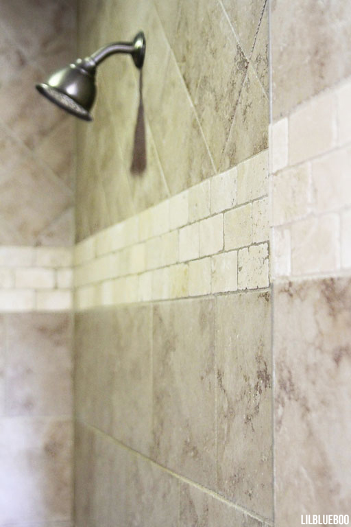 Master Bath - Walk in Shower - tile pattern mixes travertine and ceramic tile for decorating on a budget via lilblueboo.com
