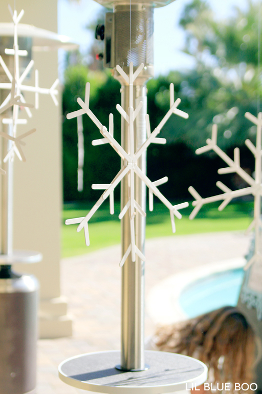 Hang snowflakes made from popsicle sticks for a Frozen Winter Birthday Party via Ashley Hackshaw / lilblueboo.com #frozen