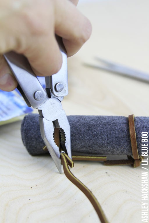 Using Wire to secure the leather straps on bedroll 