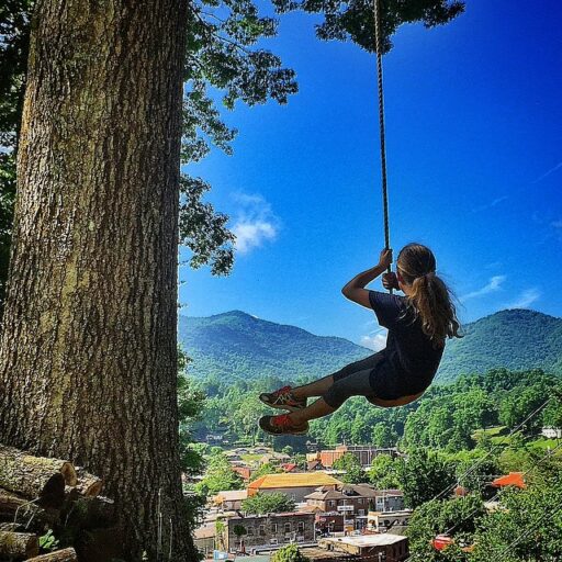 Swinging over downtown Bryson City, NC in Summer - original tree swing 