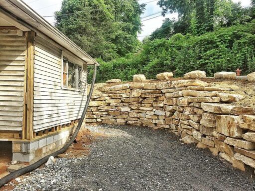 Farmhouse Renovation Rock Retaining Wall - Sixty-One Park Farmhouse