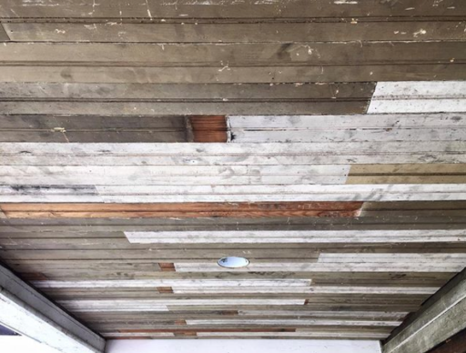 Reclaimed breadboard ceiling for the the porch